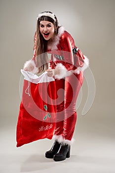 Santa girl with a sack of presents