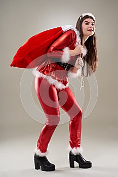 Santa girl with a sack of presents