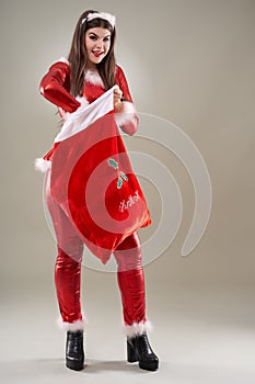 Santa girl with a sack of presents