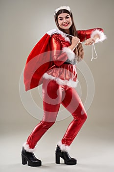 Santa girl with a sack of presents