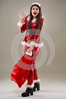 Santa girl with a sack of presents