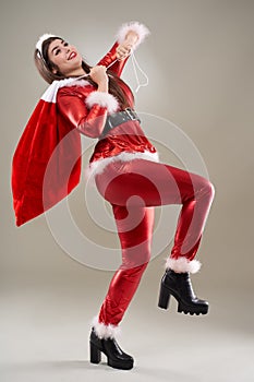 Santa girl with a sack of presents