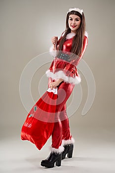 Santa girl with a sack of presents