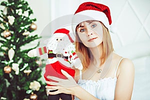 Santa girl with a toy