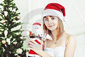 Santa girl with a toy