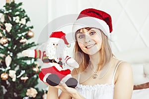 Santa girl with a toy