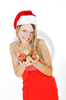 Santa girl with xmas balls in hands