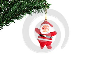 Santa hanging on branch Christmas tree.