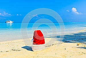 Santa hat is on a beach