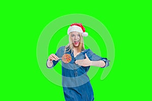 santa hat woman holding a lollipop in green screen
