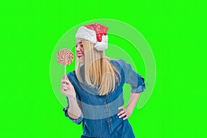 Santa hat woman holding a lollipop in green screen