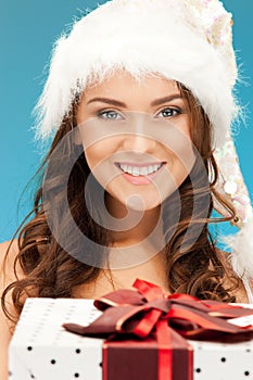 Santa helper girl with gift box