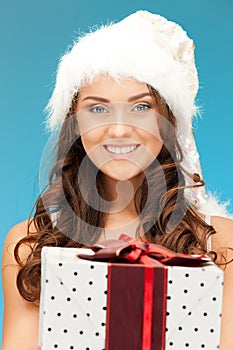 Santa helper girl with gift box