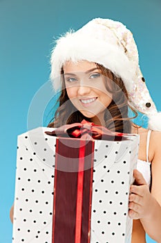 Santa helper girl with gift box