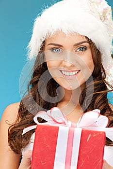 Santa helper girl with gift box