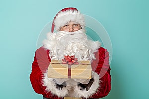 Santa holding Christmas gift box
