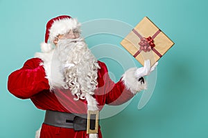 Santa holding Christmas present