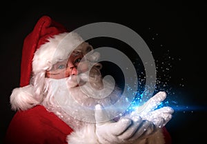 Santa holding magical lights in hands