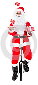 Santa juggling on monocycle photo