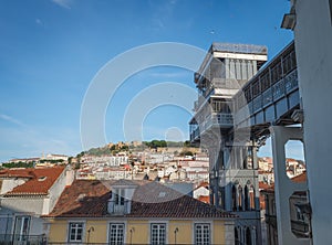 Santa Justa Lift and city view with Saint George Castle Castelo de Sao Jorge - Lisbon, Portugal