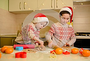 Santa kids making cookie for Santa in cozy kitchen. Santa chefs. Xmas