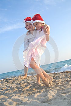 Santa kids at the summer beach