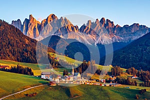 Santa Maddalena (Santa Magdalena) village with magical Dolomites mountains in autumn, Val di Funes valley, Trentino Alto Adige photo