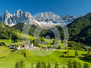 Santa Maddalena village in front of the Geisler or Odle Dolomites Group , Val di Funes, Italy, Europe. September, 2017 photo