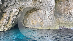 Santa Maria Caves, Comino, Malta. Boat tour summervacation in mediterranean sea