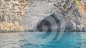 Santa Maria Caves, Comino, Malta. Boat tour summervacation in mediterranean sea