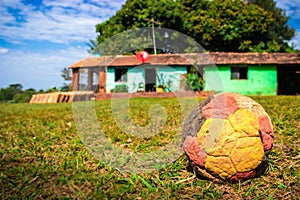 Santa Maria de Fe, Misiones, Paraguay - Deflated Football Forgotten outside a House in the Paraguayan Countryside photo