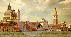 Santa Maria della Salute Basilica, St. Mark`s campanile and waterfront in Venice, Italy