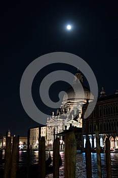 Santa Maria della Salute in Venice at night with moon overhead