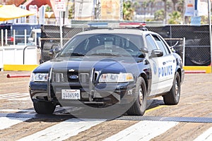 Santa Monica Police car parked in front of a pier.