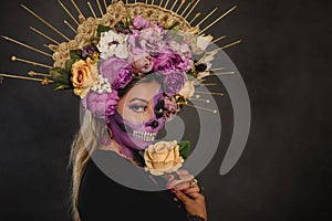 Santa Muerte, day of the dead character. Portrait of a woman with sugar skull makeup. Halloween make-up.