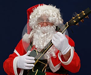 Santa playing christmas carols