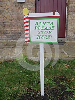 Santa please stop here sign