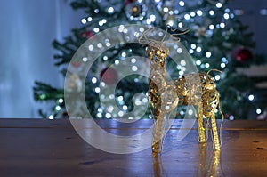 Santa reindeer and christmas tree with bright lights