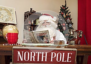 Santa Relaxes with a Magazine