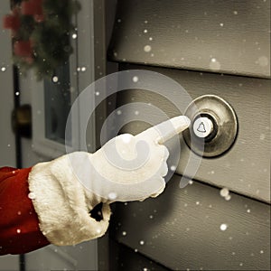 Santa is ringing a door bell