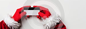 Santa s secure online payment trustworthy christmas shopping with credit card in hand photo