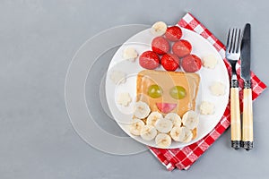 Santa sandwich made from toast, peanut butter, strawberry, banana, grape and apple, Christmas menu, horizontal,  top view,  cope