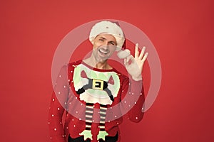 Santa says OK. Christmas elf smile showing ring gesture. Merry Christmas. Happy new year