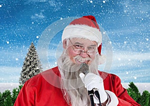 Santa singing christmas song on microphone