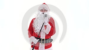 Santa singing to retro vintage microphone christmas song. Santa Claus sing to classic microphone on white background