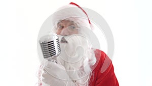 Santa singing to retro vintage microphone christmas song. Santa Claus sing to classic microphone on white background