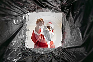 Santa throws a disposable mask in the trash. covid dissident