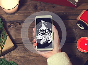 Santa use smart phone mock up with a copyspace for Christmas.