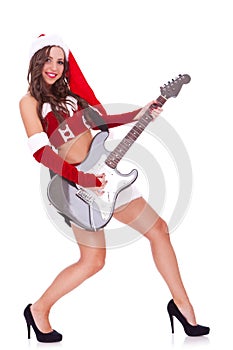 Santa woman playing an electric guitar