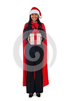 Santa woman standing holding gift box with smile, full lenght.Isolated on white background.